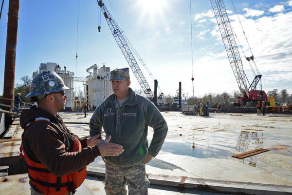 Servicemember and veteran speak at construction site